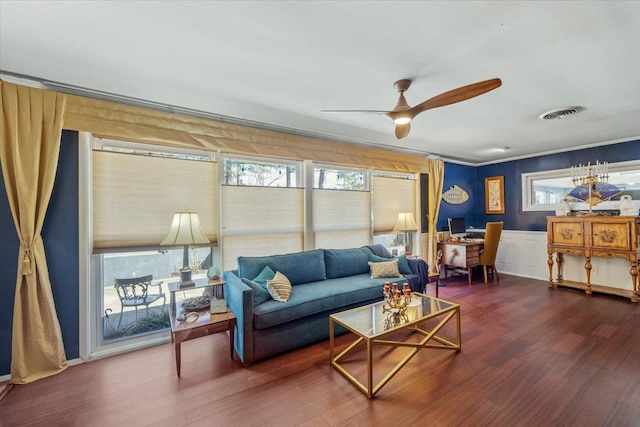 living room with ceiling fan, dark hardwood / wood-style floors, and ornamental molding