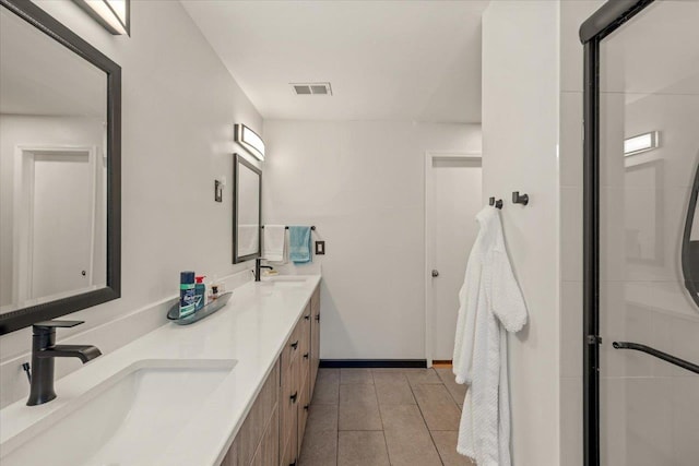 bathroom with a shower with door and vanity