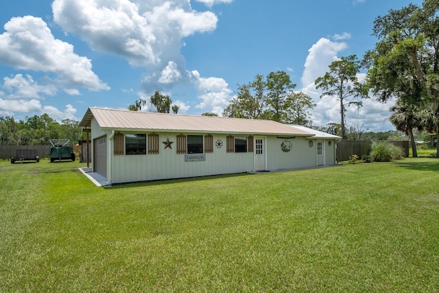 5481 Turner Rd, Perry, FL 32348 - back of house with a garage and metal roof