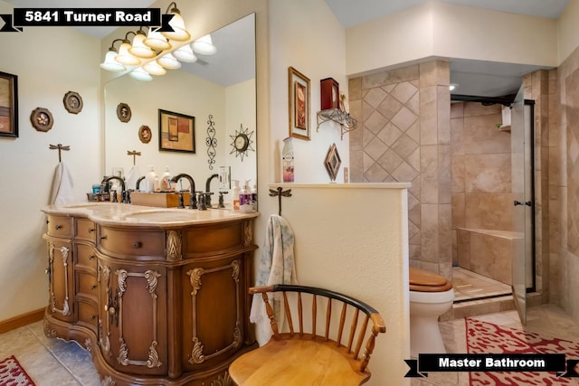 5481 Turner Rd, Perry, FL 32348 - bathroom featuring tile patterned floors, a tile shower, vanity, and toilet