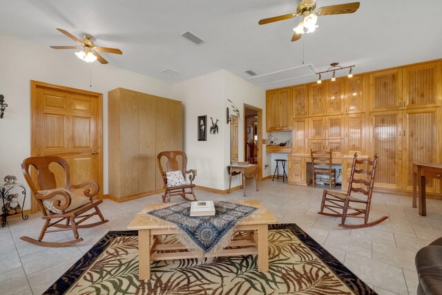 5481 Turner Rd, Perry, FL 32348 - living area featuring ceiling fan, attic access, and baseboards