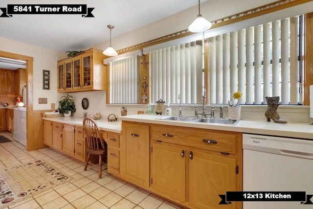 5481 Turner Rd, Perry, FL 32348 - kitchen featuring white dishwasher, a sink, pendant lighting, washer / dryer, and a wainscoted wall