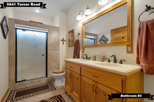 5481 Turner Rd, Perry, FL 32348 - full bath featuring a shower with door, tile patterned flooring, toilet, and double vanity