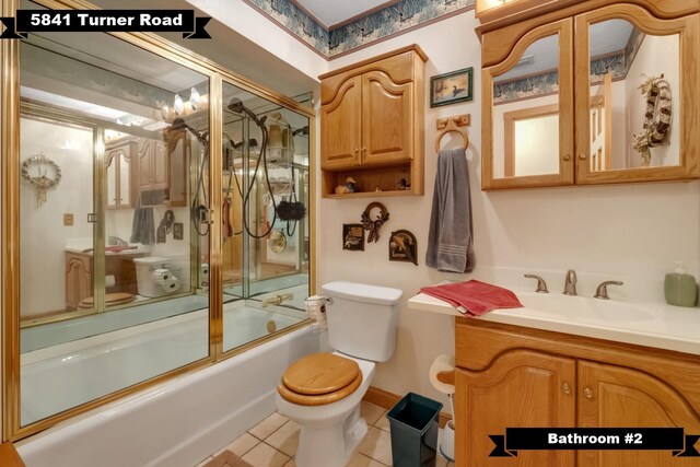5481 Turner Rd, Perry, FL 32348 - bathroom featuring toilet, combined bath / shower with glass door, vanity, and tile patterned floors