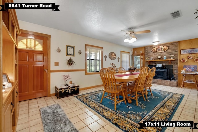 5481 Turner Rd, Perry, FL 32348 - dining space featuring light tile patterned floors, a ceiling fan, and baseboards
