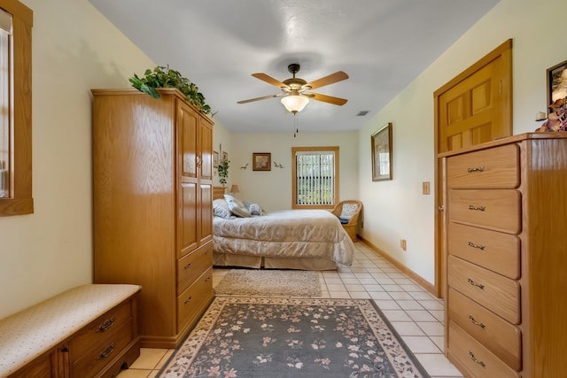 5481 Turner Rd, Perry, FL 32348 - bedroom featuring light tile patterned floors, a ceiling fan, and baseboards