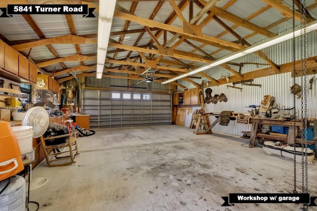 5481 Turner Rd, Perry, FL 32348 - garage featuring a workshop area and a garage door opener