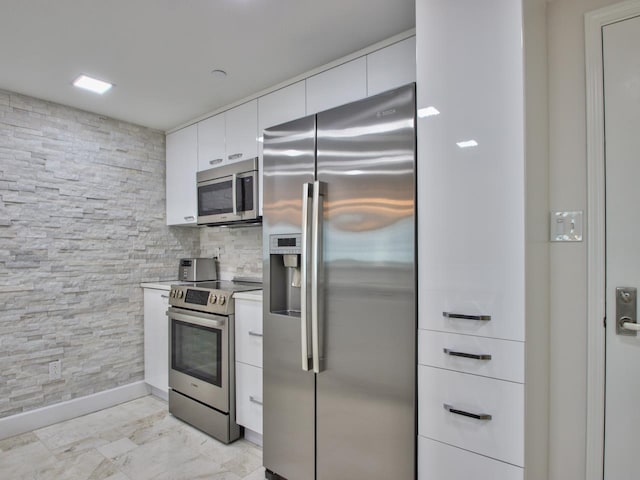 300 S Duval St Unit 2006, Tallahassee, FL 32301 - kitchen featuring appliances with stainless steel finishes, white cabinetry, and modern cabinets