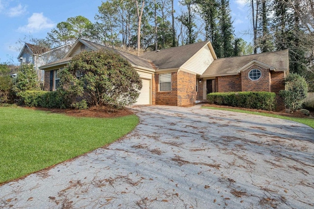 view of front facade featuring a garage and a front lawn