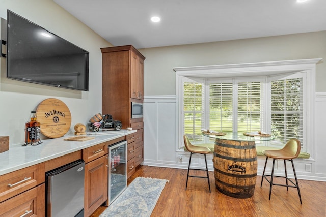 1244 Salem Rd, Havana, FL 32333 - kitchen with beverage cooler, brown cabinets, dark wood-style floors, light countertops, and recessed lighting
