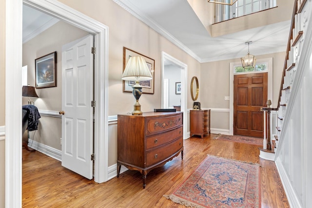 1244 Salem Rd, Havana, FL 32333 - entrance foyer with light wood-style flooring, crown molding, a chandelier, stairway, and baseboards