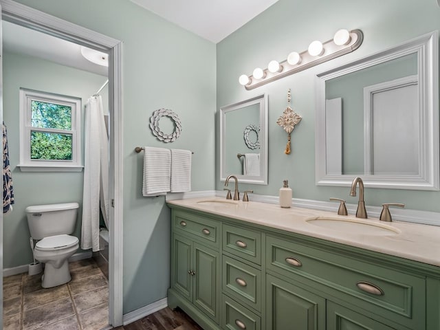 full bathroom with toilet, vanity, shower / tub combo with curtain, and tile patterned flooring