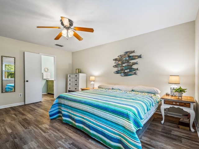 bedroom featuring ceiling fan, dark wood-type flooring, and connected bathroom