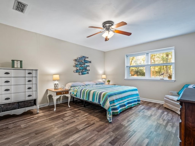 bedroom featuring ceiling fan and dark wood-type flooring