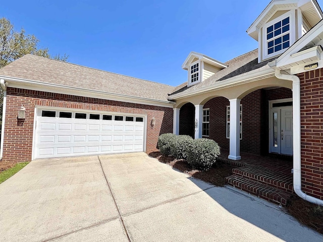 2541 Lagrange Trl, Tallahassee, FL 32312 - view of property exterior with driveway, brick siding, and roof with shingles