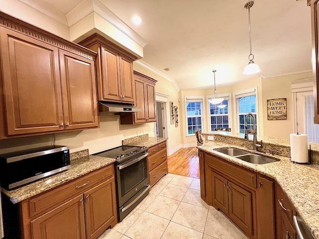 2541 Lagrange Trl, Tallahassee, FL 32312 - kitchen featuring stainless steel appliances, under cabinet range hood, ornamental molding, light stone countertops, and pendant lighting