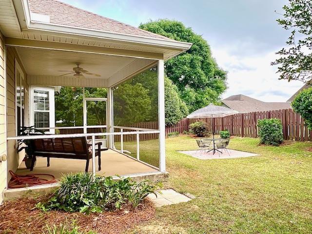 2541 Lagrange Trl, Tallahassee, FL 32312 - fenced backyard featuring a ceiling fan and a patio area
