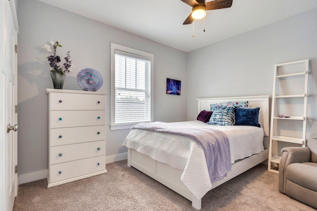 bedroom with light colored carpet and ceiling fan