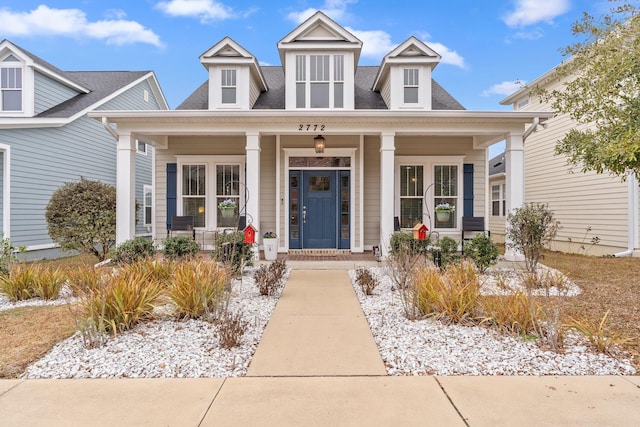 cape cod house with covered porch