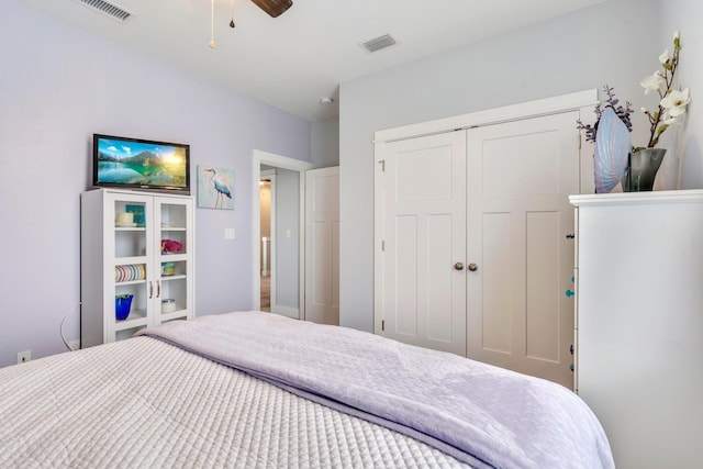 bedroom featuring ceiling fan and a closet