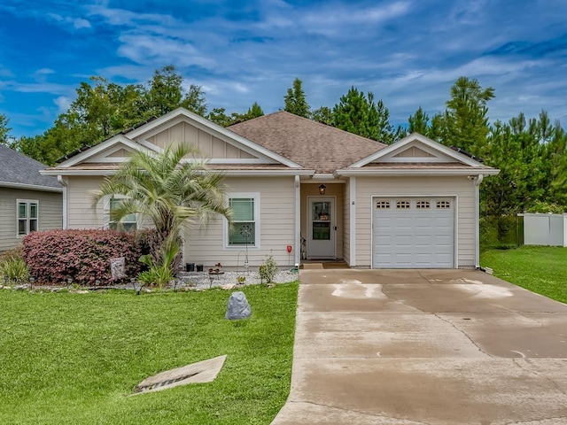 ranch-style home featuring a garage and a front lawn