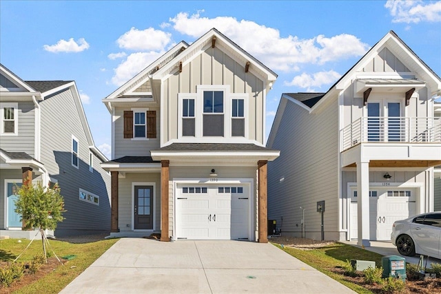 view of front facade featuring a garage and a balcony