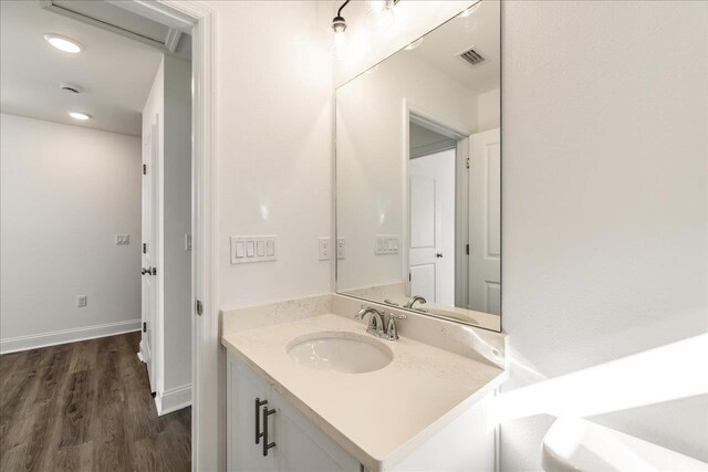 bathroom featuring vanity and hardwood / wood-style flooring