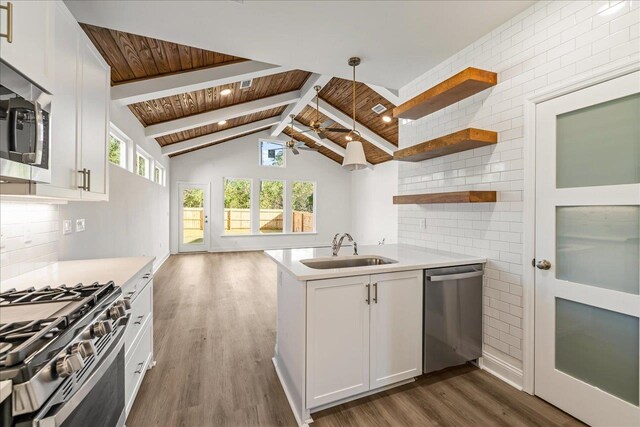 kitchen with stainless steel appliances, white cabinets, sink, and wood ceiling