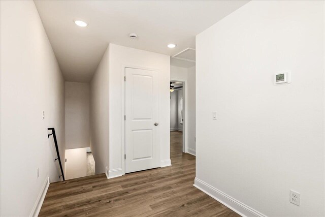 corridor featuring dark wood-type flooring