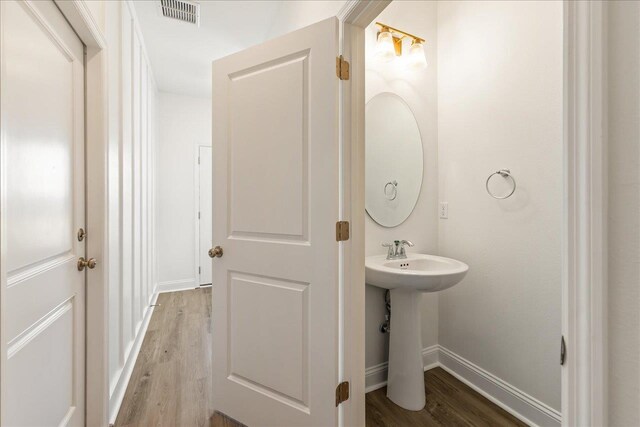 bathroom featuring sink and hardwood / wood-style floors