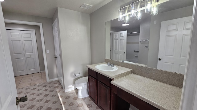 2801 Chancellorsville Dr Unit 1316, Tallahassee, FL 32312 - full bath featuring toilet, vanity, a shower, tile patterned flooring, and baseboards