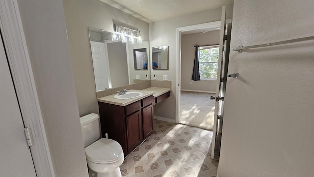 2801 Chancellorsville Dr Unit 1316, Tallahassee, FL 32312 - bathroom with toilet, vanity, and baseboards