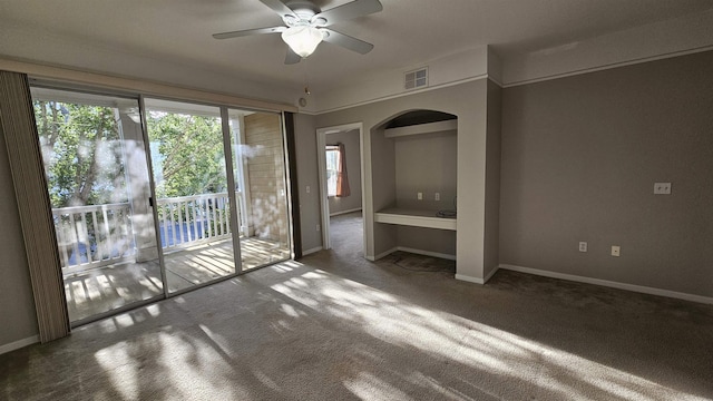 2801 Chancellorsville Dr Unit 1316, Tallahassee, FL 32312 - carpeted empty room featuring a ceiling fan, arched walkways, and baseboards