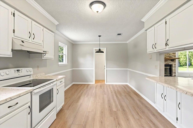 1538 Mclawrence Way, Tallahassee, FL 32317 - kitchen featuring white electric range, under cabinet range hood, a textured ceiling, white cabinetry, and light wood-type flooring