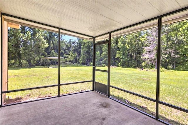 1538 Mclawrence Way, Tallahassee, FL 32317 - unfurnished sunroom with view of scattered trees