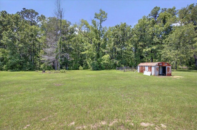1538 Mclawrence Way, Tallahassee, FL 32317 - view of green lawn featuring a wooded view