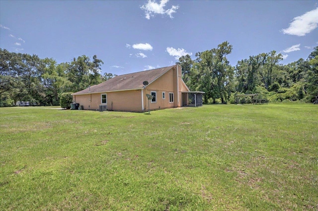 1538 Mclawrence Way, Tallahassee, FL 32317 - view of side of home featuring a yard, a chimney, and cooling unit