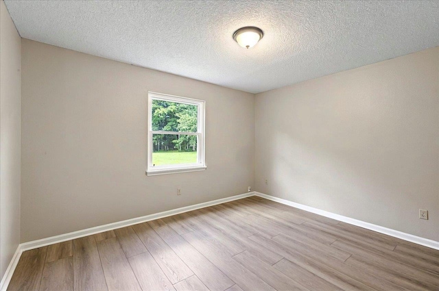 1538 Mclawrence Way, Tallahassee, FL 32317 - unfurnished room featuring wood finished floors, baseboards, and a textured ceiling