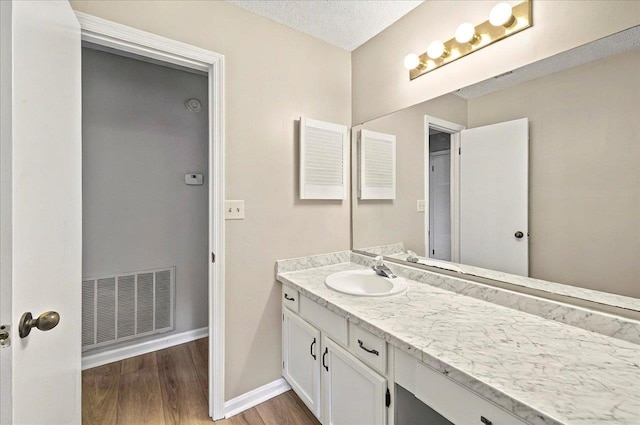 1538 Mclawrence Way, Tallahassee, FL 32317 - bathroom with vanity, wood finished floors, and baseboards