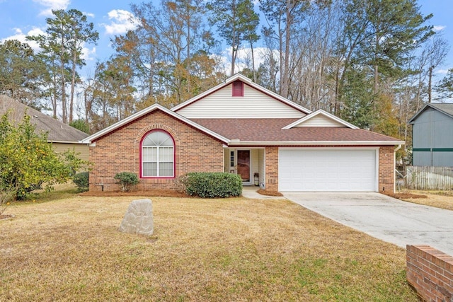 view of front of property featuring a garage and a front lawn