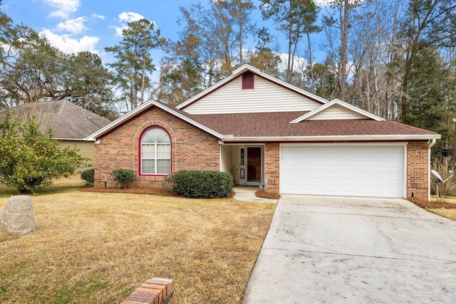 view of front of house featuring a garage and a front yard