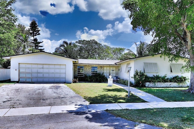 ranch-style house with a front yard and a garage