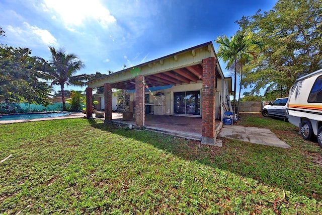 view of yard featuring a patio and a swimming pool