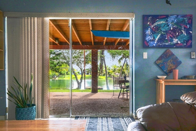 entryway featuring a wealth of natural light and a water view