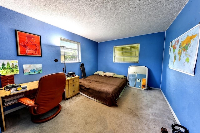 carpeted bedroom featuring a textured ceiling