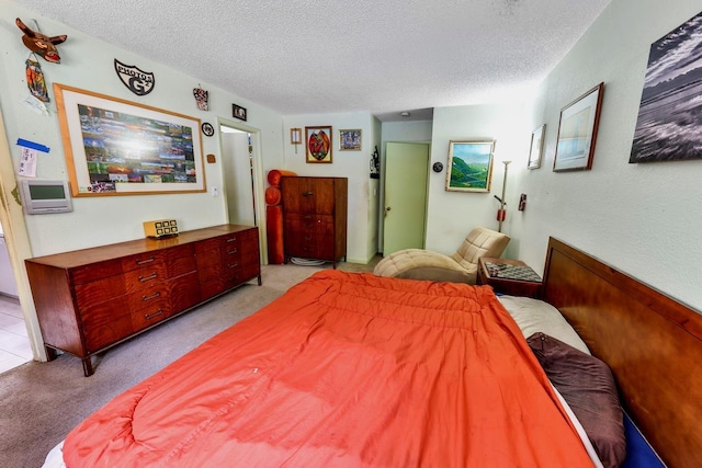 carpeted bedroom with a textured ceiling