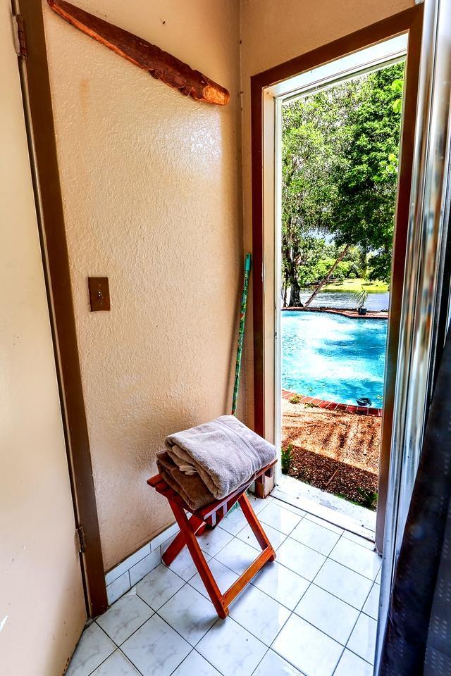 doorway to outside featuring light tile patterned floors