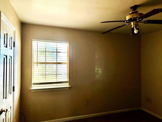 spare room with ceiling fan