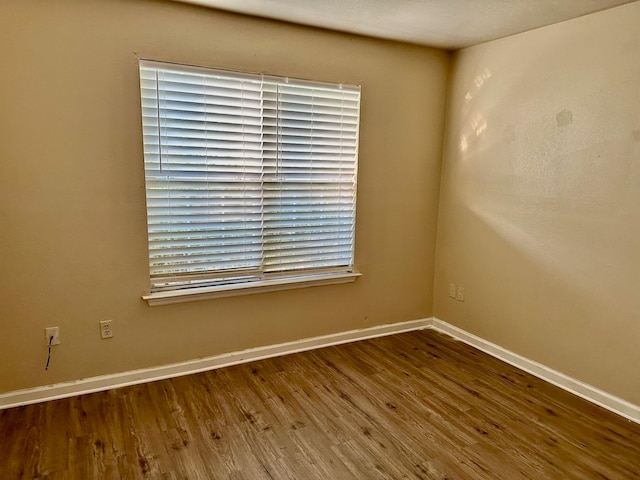 spare room featuring hardwood / wood-style floors