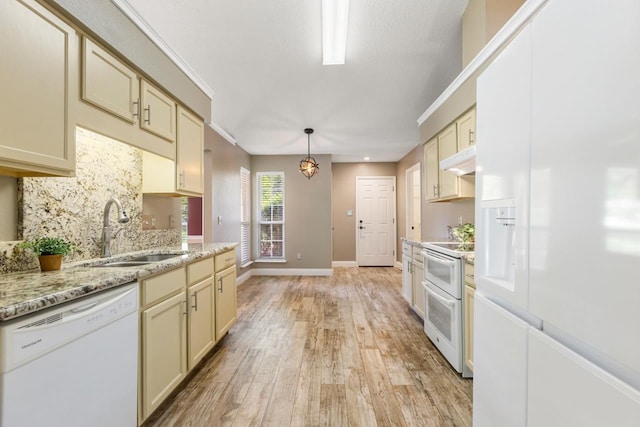 2304 Chester Ct, Tallahassee, FL 32312 - kitchen with under cabinet range hood, a sink, white appliances, light wood-style floors, and decorative backsplash